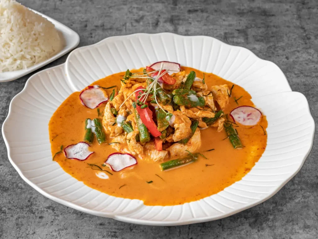 Panang curry with chicken, green beans and jasmine rice at Thai Food Near Me NYC